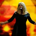 (FILES) Britain's Bonnie Tyler performs during the finals of the 2013 Eurovision Song Contest in Malmo, Sweden on May 18, 2013. British singer Bonnie Tyler, the 1980s star known for her hit Total Eclipse of the Heart, has died at the age of 75, her family announced Thursday in a statement. Bonnies family and team are heartbroken to announce that Bonnie passed away unexpectedly last night in a hospital in Portugal as a result of the illness for which she was being treated, the statement published on the stars Facebook account reads. (Photo by Jonathan NACKSTRAND / AFP)