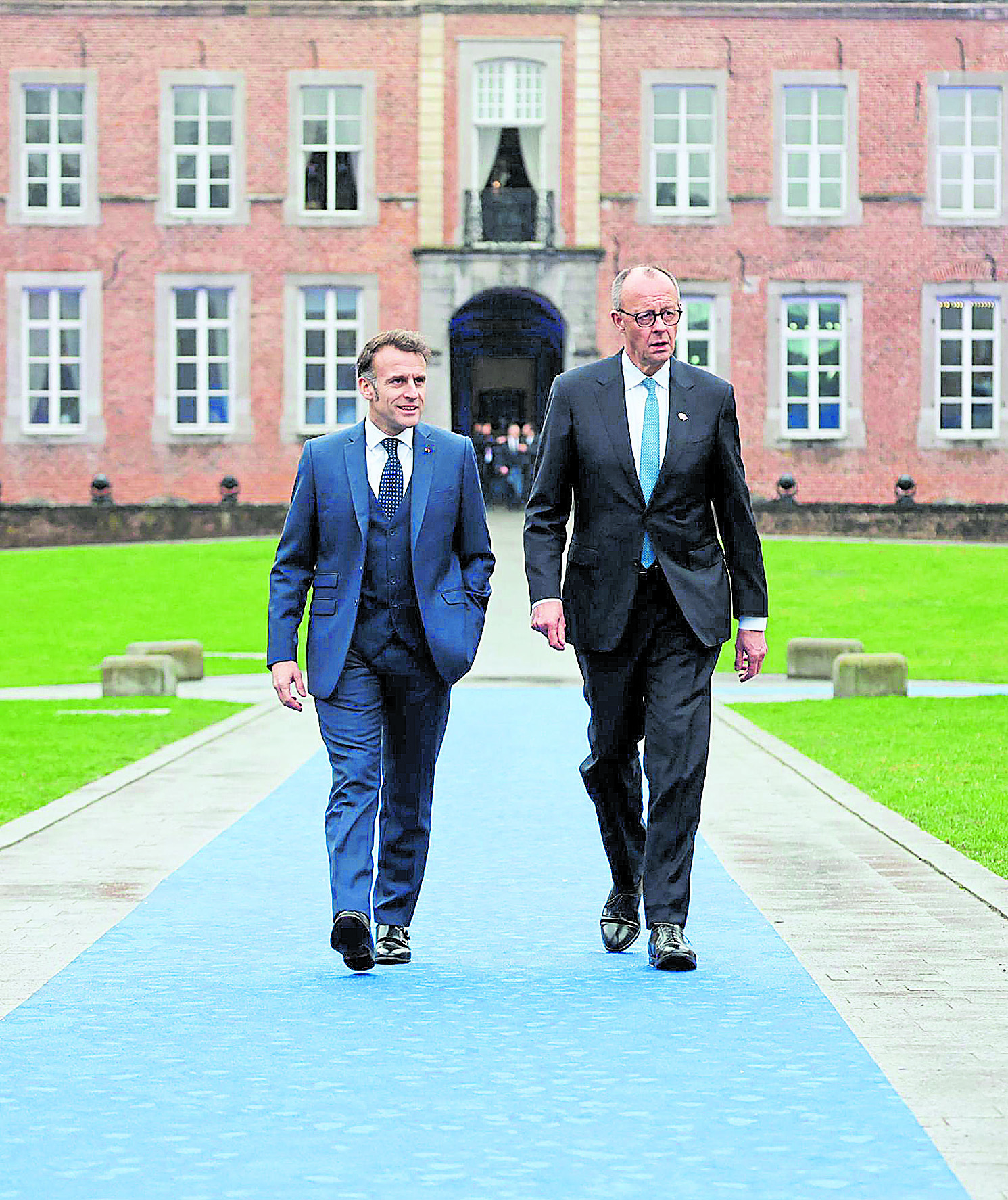 El presidente de Francia, Emmanuel Macron, y el canciller de Alemania, Friedrich Merz, a su llegada esta semana a una reunión de líderes de la UE en Bélgica. Foto: Ludovic Marín. AFP.